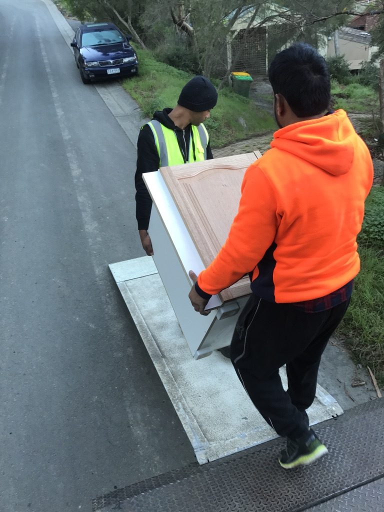 Two man unloading a furniture